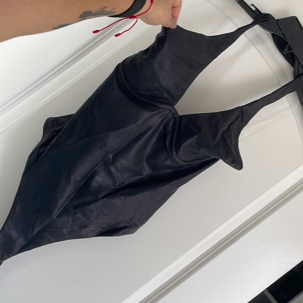 Naked wardrobe faux leather thong bodysuit